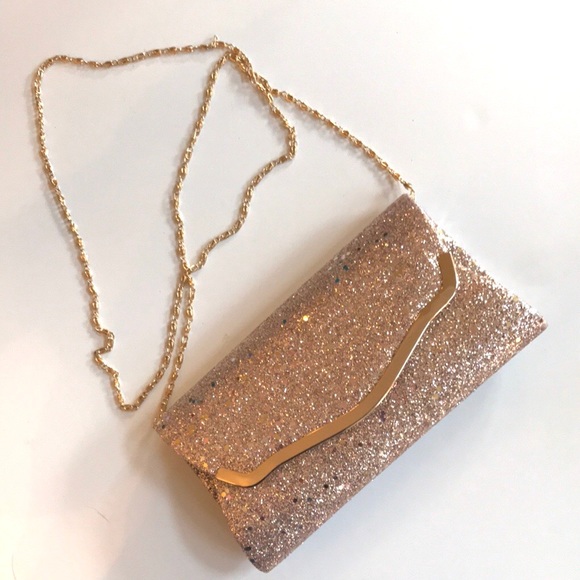 dillards Handbags - Rose gold clutch